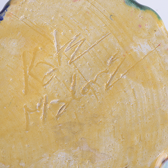 An incised signature by Kate Malone