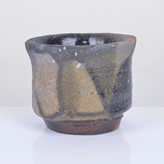 A stoneware black bizen guinomi made by Isezaki Jun sold at auction by Maak