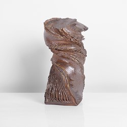 A brown stoneware twisted vase made by Shozo Michikawa