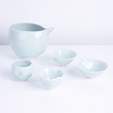 A pale blue celadon porcelain sake set made by Fukami Sueharu sold at auction by Maak 